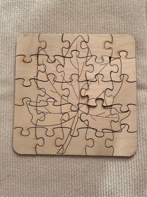 Wooden puzzle with autumn leaves like new