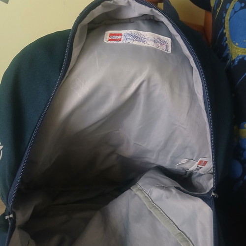 School bag used with visible defects