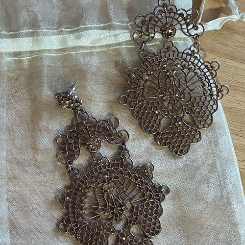 Long gold-plated earrings used with bronze-tone rhinestones