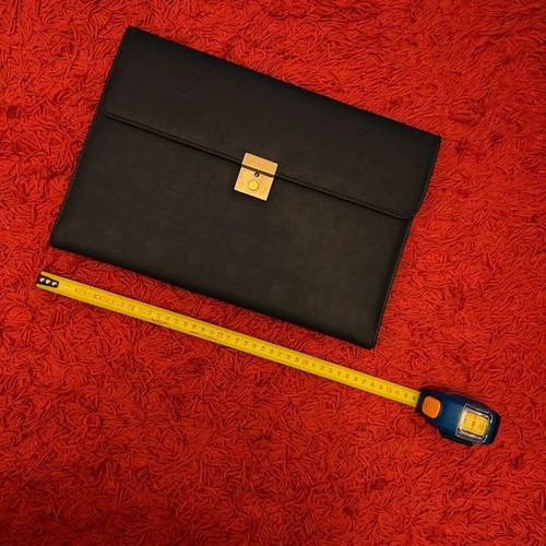 Clutch used, black with gold clasp, leatherette material