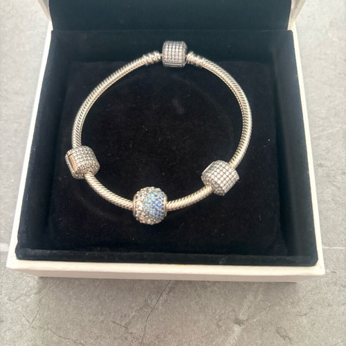 Pandora silver bracelet new with 4 charms and zirconia