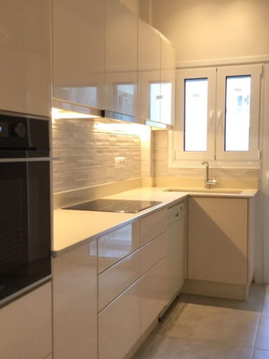 Modern kitchen with quartz countertop and granite undermount sink like new, beige lacquer