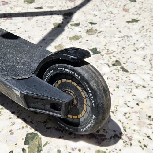 Root Industries Invictus Gold Rush freestyle scooter used with helmet and pads