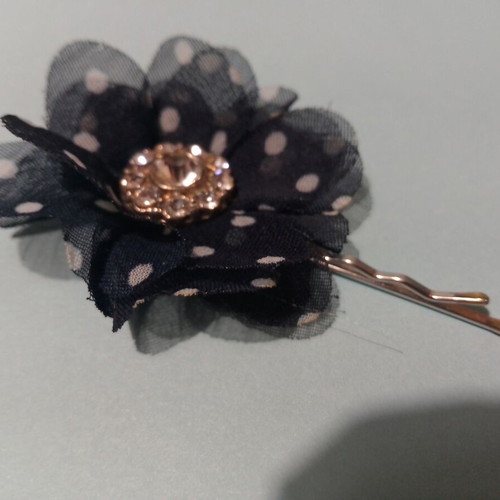 Hair accessory with blue and white flower and rhinestones