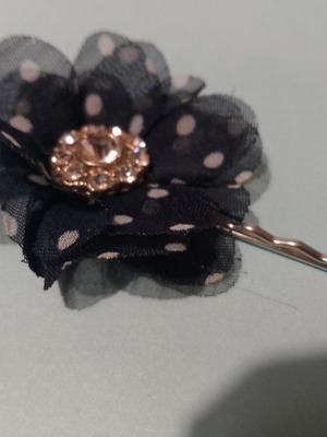 Hair accessory with blue and white flower and rhinestones