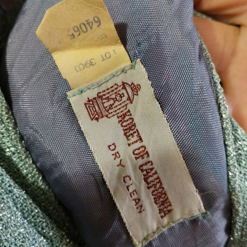 Vintage dress used with silver thread and subtle signs of wear