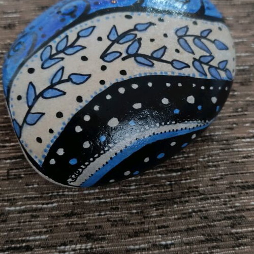 Painted stone new with acrylics and glossy varnish