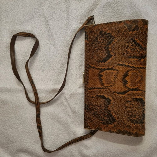 Crossbody bag used with python print leather pattern