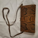 Crossbody bag used with python print leather pattern
