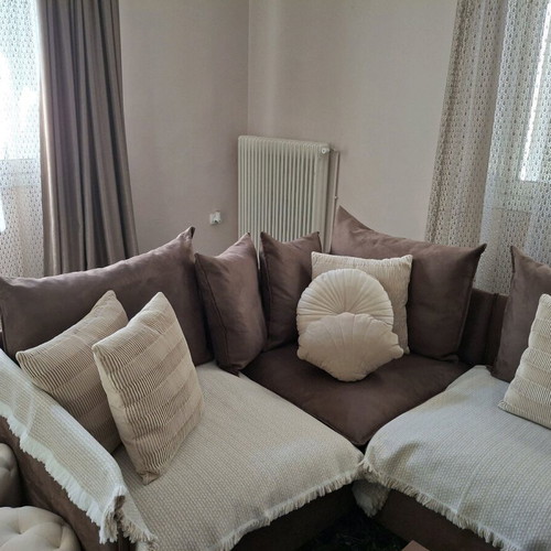 Corner sofa four-seater used, brown without covers and beige cushions