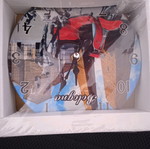 Wall clock new in its plastic wrap