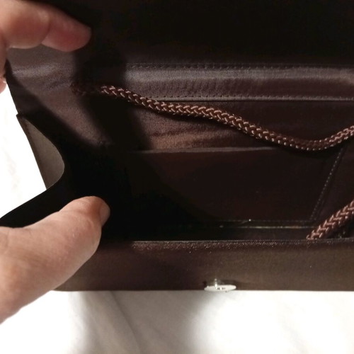 Official hand bag like new in brown shades with sequins