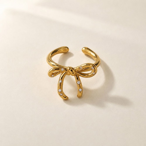Adjustable bow ring with rhinestones, new, gold tone
