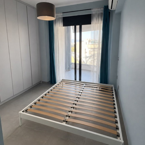 IKEA bed frame 140×200 cm like new, white metal with wooden slats