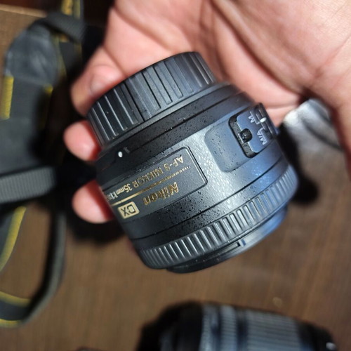 Nikon D5200 DSLR with Nikkor 35mm f/1.8G lens and accessories