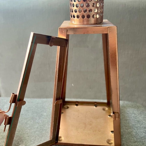 Metal candle lantern used, copper color