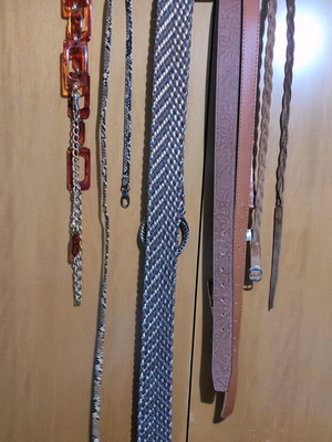 Set of five belts in brown shades like new, with bone and chain, leatherette and suede