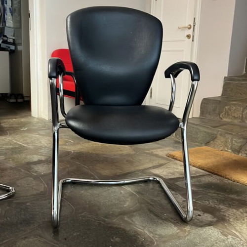 Conference table and 4 metal leather chairs used