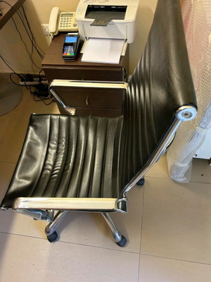 Neoset executive office chair used with ribbed black leather and chrome frame