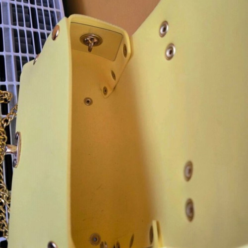 Women's yellow shoulder bag made of foam, used