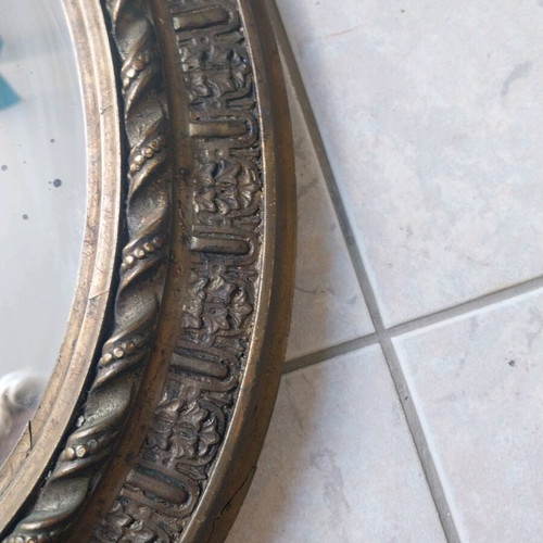 Oval mirror with carved wooden base, vintage
