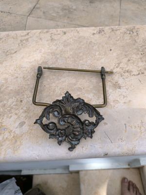 Bronze toilet paper holder used
