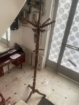 Coat rack used, stands very well