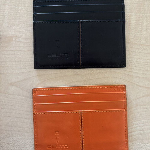 Delta leather card holders, black and orange