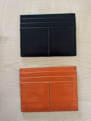 Delta leather card holders, black and orange