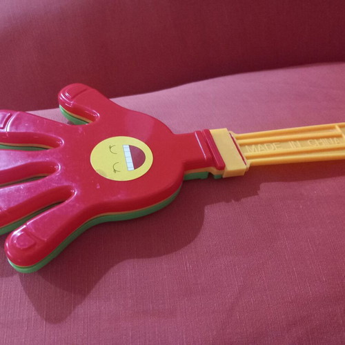 Hand Clapper toy used, plastic noise maker