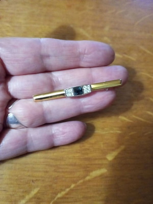 Jewelry pin like new, gold color with blue and clear stones