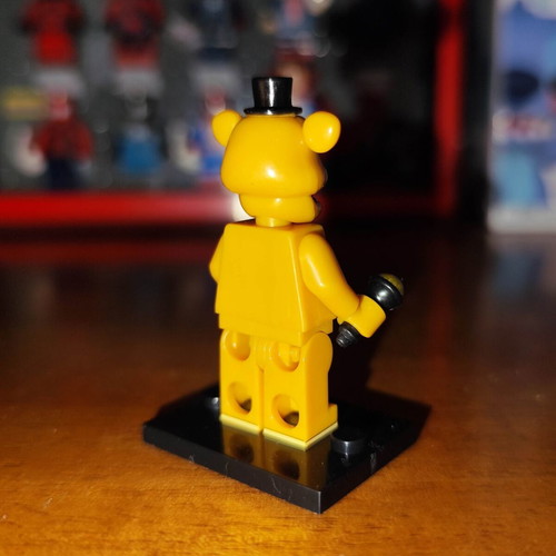 Golden Freddy figure like new with stand and microphone