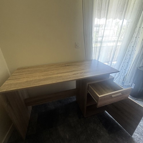 Wooden desk with drawer and open storage, brown oak finish