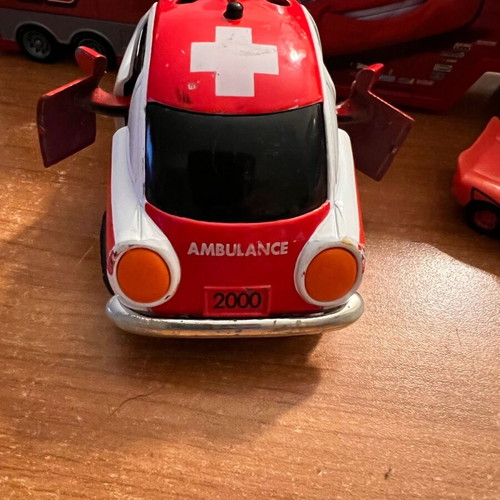 Ambulance toy car used with opening doors and pull-back mechanism
