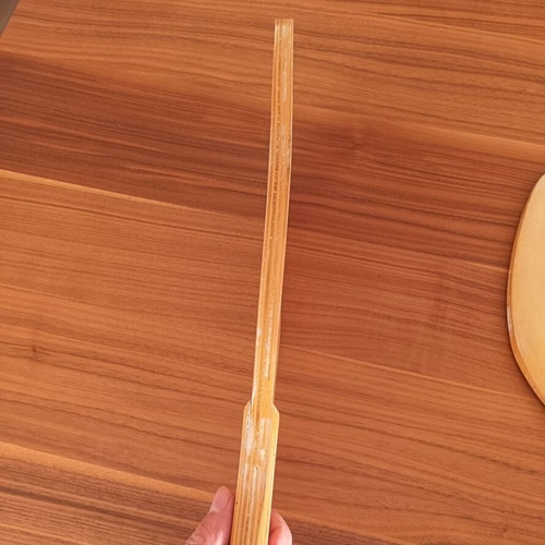 Wooden beach rackets with sun design used, pair
