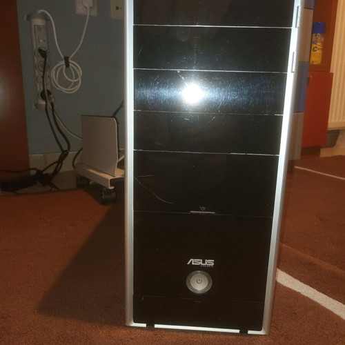 Asus computer tower used with stand and keyboard