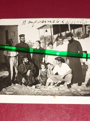 Old black and white photo 1957 with family and priests