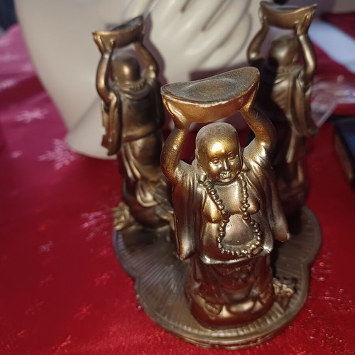 Asian candlestick with 3 smiling figures used, bronze finish