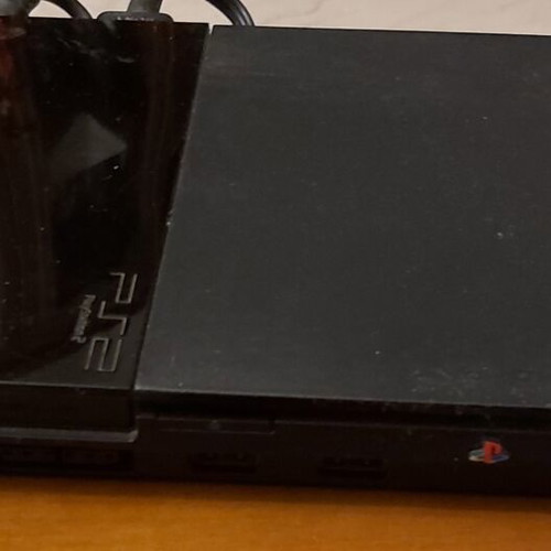 Sony PlayStation 2 console used with remote and 10 games