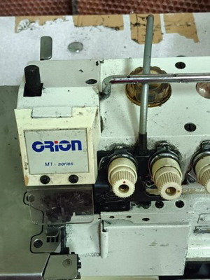 Four-thread overlock sewing machine with cutter used