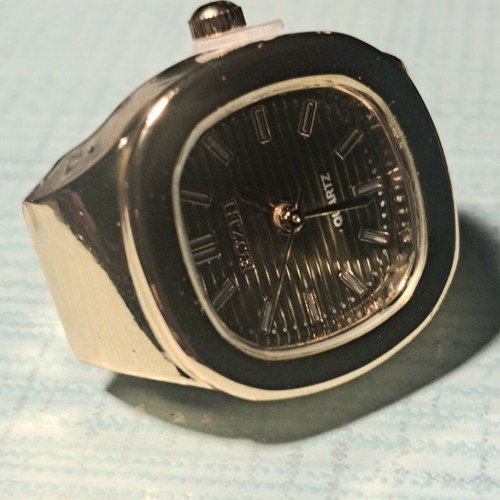 Ring watch with khaki dial and gold bracelet