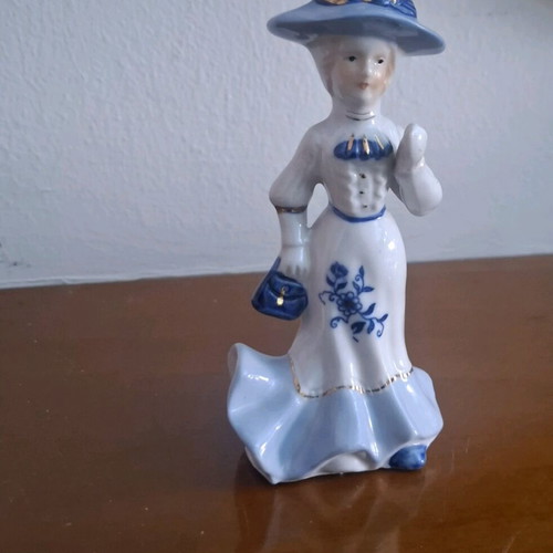 Retro porcelain woman figurine with gold details like new