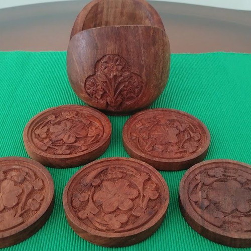Handmade wooden coasters like new, set of six with carved floral designs