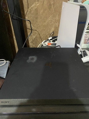 Sony PlayStation 4 Pro 1TB console with controller and cables