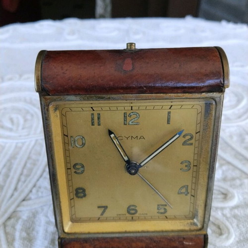 Cyma table clock used, Swiss made, brass with leather