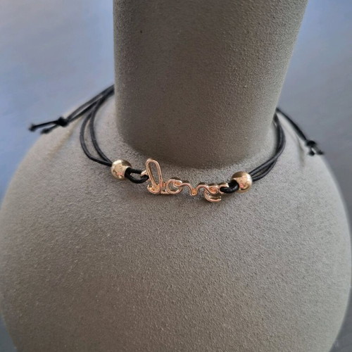 Love bracelet new with adjustable black and gold elastic