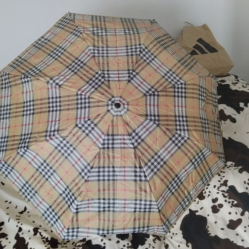 Vintage unisex folding umbrella with wooden handle, used