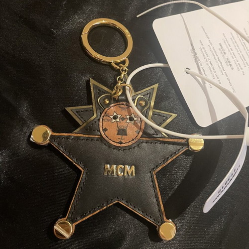 MCM Star Lion bag charm new, black and brown