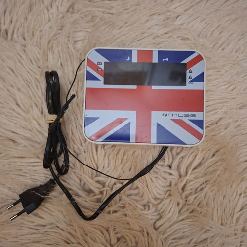 Muse M-10 SNZ digital radio clock used with United Kingdom flag