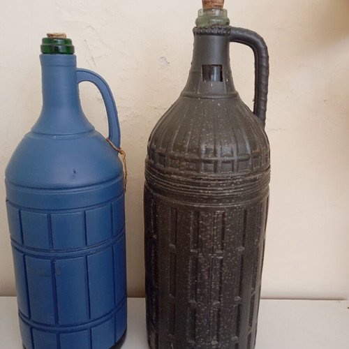 Glass bottles set of 2 used, one with moisture marks
